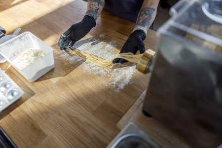 Engaging in Creative Cooking and Food Preparation within a Modern Kitchen Environmentの写真素材