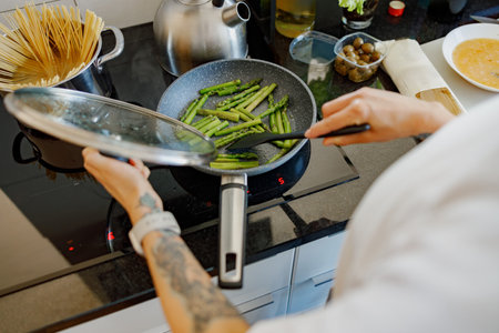 Healthy Cooking Sauting Fresh Asparagus in the Kitchen