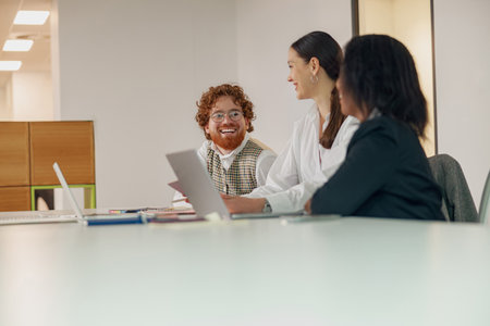 Engaging in a Collaborative Team Meeting within a Modern Office Setting for success and growthの写真素材