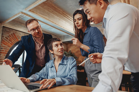 Team Collaboration in a Contemporary Office Environment for Enhanced Productivity and Successの写真素材