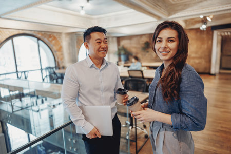 Professionals Collaborating in a Modern Office for Improved Productivity and Engagementの写真素材