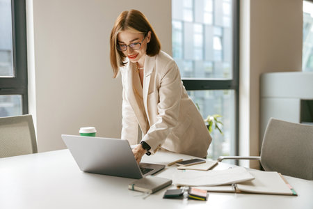 A Professional Woman Engaged in Her Work Inside a Modern Office Environment Setting