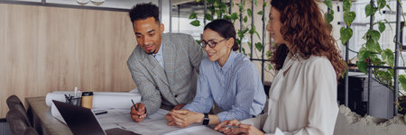 Engaging in a Collaborative Team Meeting within a Modern and Innovative Workspace Setting