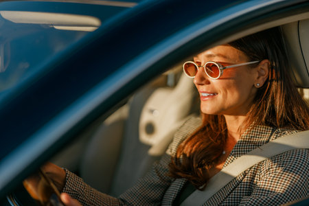 A Confident Woman Embracing Her Adventure While Driving Stylishly in Trendy Sunglasses