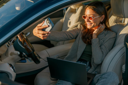 A Woman Enjoying a Virtual Meeting in a Very Stylish Car While Bridging Connections Effectively