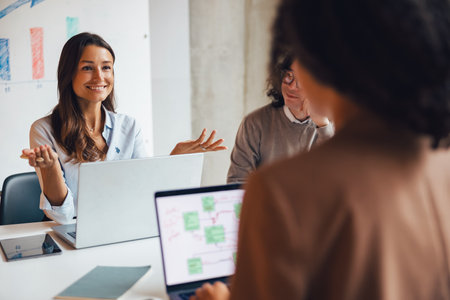 Participating in an Engaging and Productive Team Meeting Within a Bright Office Space