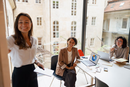 Participating in a Collaborative Business Meeting in a Modern, techequipped Officeの写真素材
