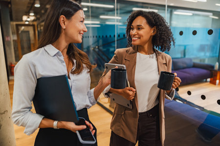 Colleagues collaborate positively in an office that fosters teamwork and innovation