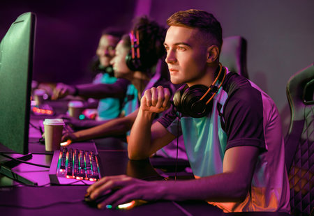Focusing with intense concentration and determination during competitive gaming sessions