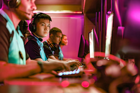 Competitive Gamers Thriving in Action at a Dynamic Esports Arena Event Experienceの写真素材