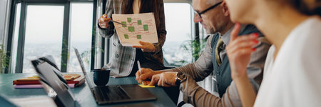 An important business meeting taking place with a presentation in a modern office environmentの写真素材