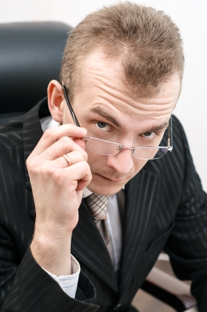 Businessman with a serious look in glasses  Black jacket の写真素材