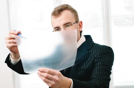 Businessman with a serious look in glasses  Black jacket の写真素材