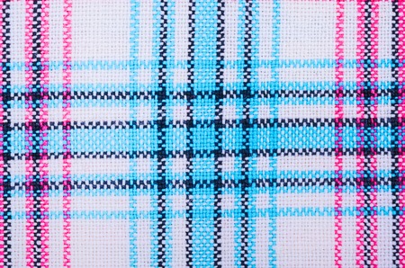 Surface of colorful cross-stitch pattern textile  in macro style.の写真素材