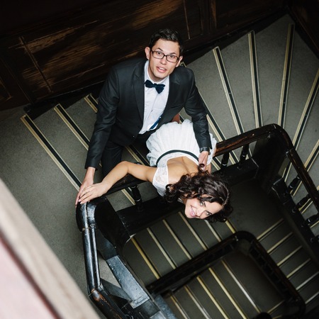 Young couple posing on staircase.の写真素材