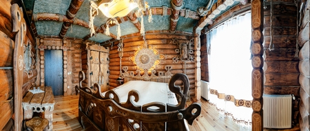 Unique ethnic interior of The hotel room. Ukrainian style and specific decorations of Cossacks historical period.の写真素材