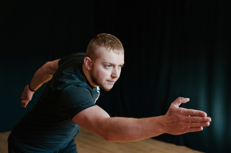 Young man making exercises for motor coordination.の写真素材