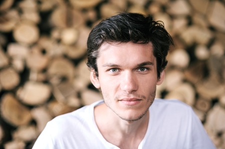 A close-up portrait of a handsome young man.の写真素材