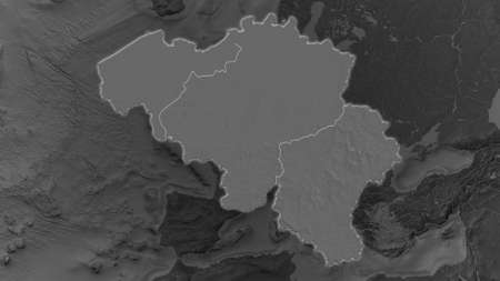 Belgium area enlarged and glowed on a darkened background of its surroundings. Bilevel bumped elevation mapの写真素材