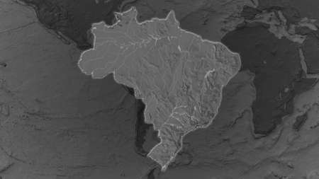 Brazil area enlarged and glowed on a darkened background of its surroundings. Bilevel bumped elevation mapの写真素材