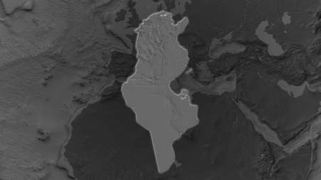 Tunisia area enlarged and glowed on a darkened background of its surroundings. Bilevel bumped elevation mapの写真素材