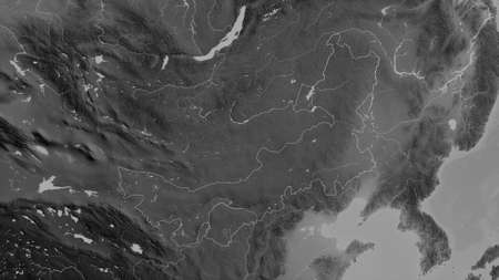 Nei Mongol, autonomous region of China. Grayscaled map with lakes and rivers. Shape outlined against...