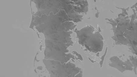 Syddanmark, region of Denmark. Grayscaled map with lakes and rivers. Shape outlined against its...