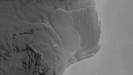 Gaza, province of Mozambique. Grayscaled map with lakes and rivers. Shape outlined against its...