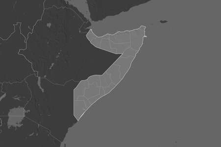 Shape of Somalia separated by the desaturation of neighboring areas. Borders. Bilevel elevation map. 3D renderingの写真素材