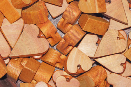 Hearts made of wood, souvenirs for Valentine's Day as a background, kurpny plan.