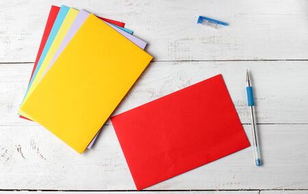 The concept of a congratulatory mail envelope with pen, on a white background, place for text.の写真素材