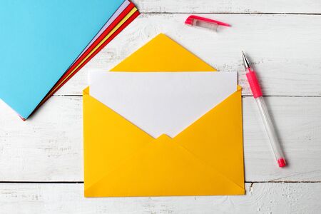 The concept of a congratulatory mail envelope with pen, on a white background, place for text.の写真素材