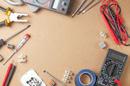 Flat lay electrician tools and instruments for working on a craft background, place for text.の写真素材