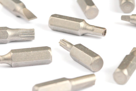 Screwdriver bit set close-up, white background.