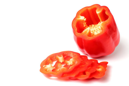 Sliced sweet bell pepper close-up on a white background, top view, flat lay, isolate, copy space.の写真素材