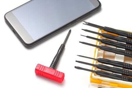 Screwdriver set for handphone repair, tools for repairing a smart phone or tablet, close-up, white background, concept.の写真素材