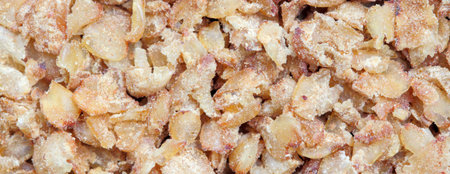 Wide view buckwheat flakes as a background. Vegetarian food. Flat lay, top view, copy space.