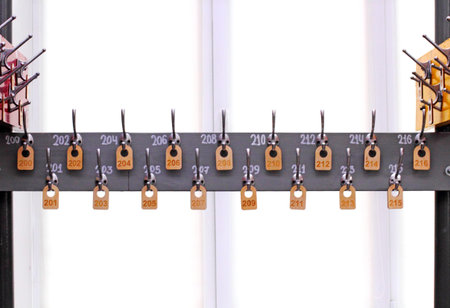 Empty hangers in a school wardrobe waiting for students. School or education theme concept.
