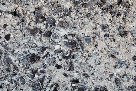 Surface coals and ash as a background of a dark tone, gray natural color.