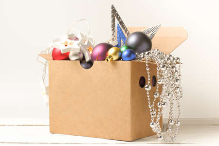 Box with garlands and balls, stars, tinsel. Christmas and New Year decorations, close-up.の写真素材