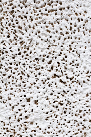 Decorative painted plaster texture, close-up, unique bit pattern.