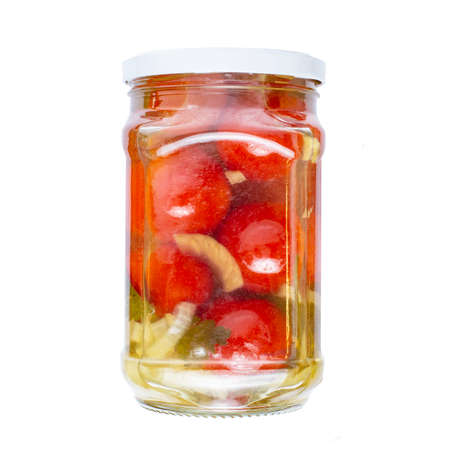 Glass jar with canned tomatoes, isolate without shadow on white. Homemade canned food example.の写真素材