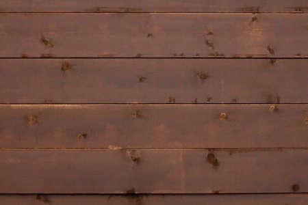 The texture of the boards made of antique wood, a dark brown background.の写真素材