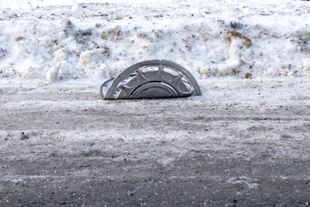 Car disk broken on a snowy road, car accident and slippery road concept.