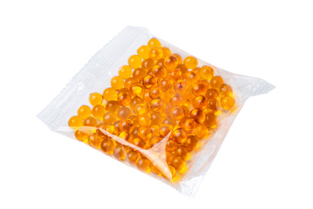 Packaging with capsules or pills of fish oil or vitamin D on white, isolate.