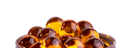 Wide view, label or banner mockup, capsules or pills with fish oil or krill oil as backgroundの写真素材