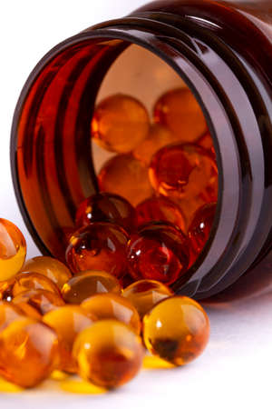 Capsules or pills krill oil or fish oil in a bottle, vitamin D omega-3.の写真素材