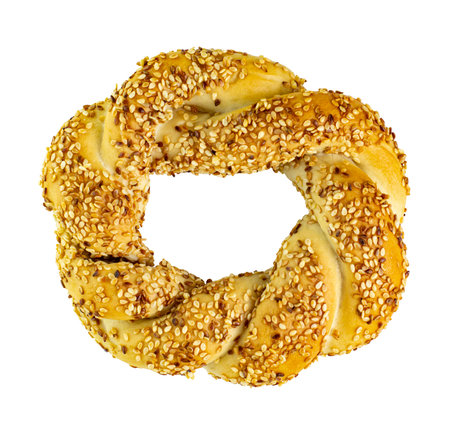 Fresh bagel with sesame seeds isolated on white.