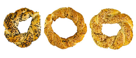 Set of fresh bagels with sesame seeds on white isolated