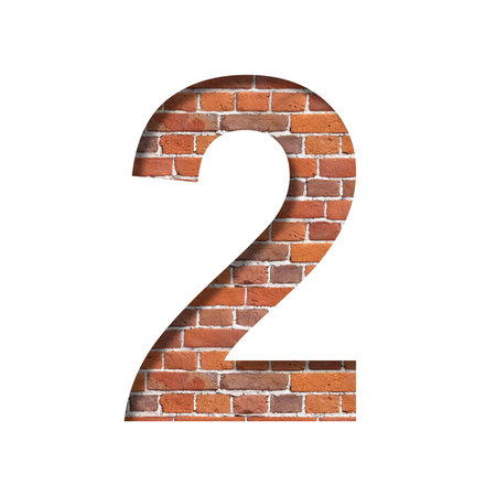 Font on brick texture. Digit two, 2, cut out of paper on a background of real brick wall. Volumetric...